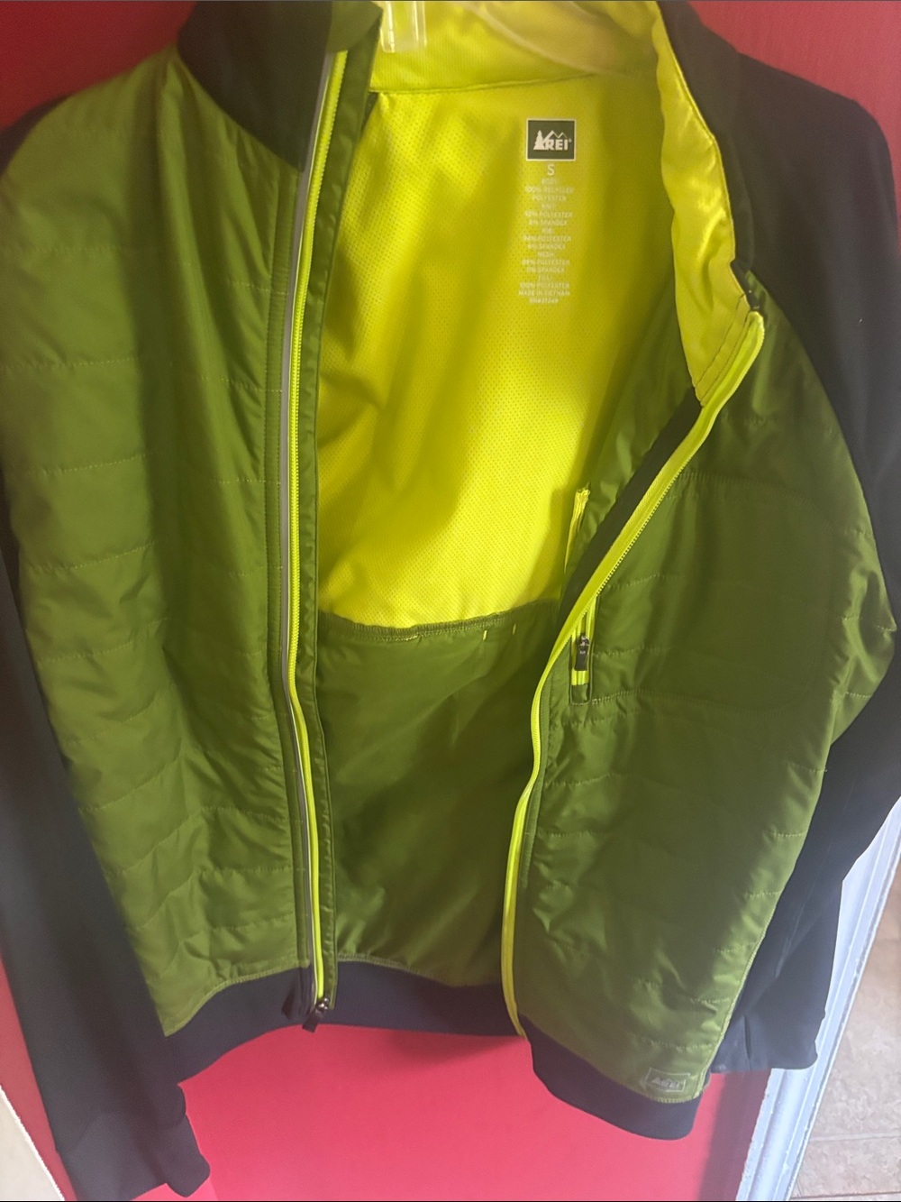 REI Olive Green and black Jacket with Yellow Interior. Performance jacket